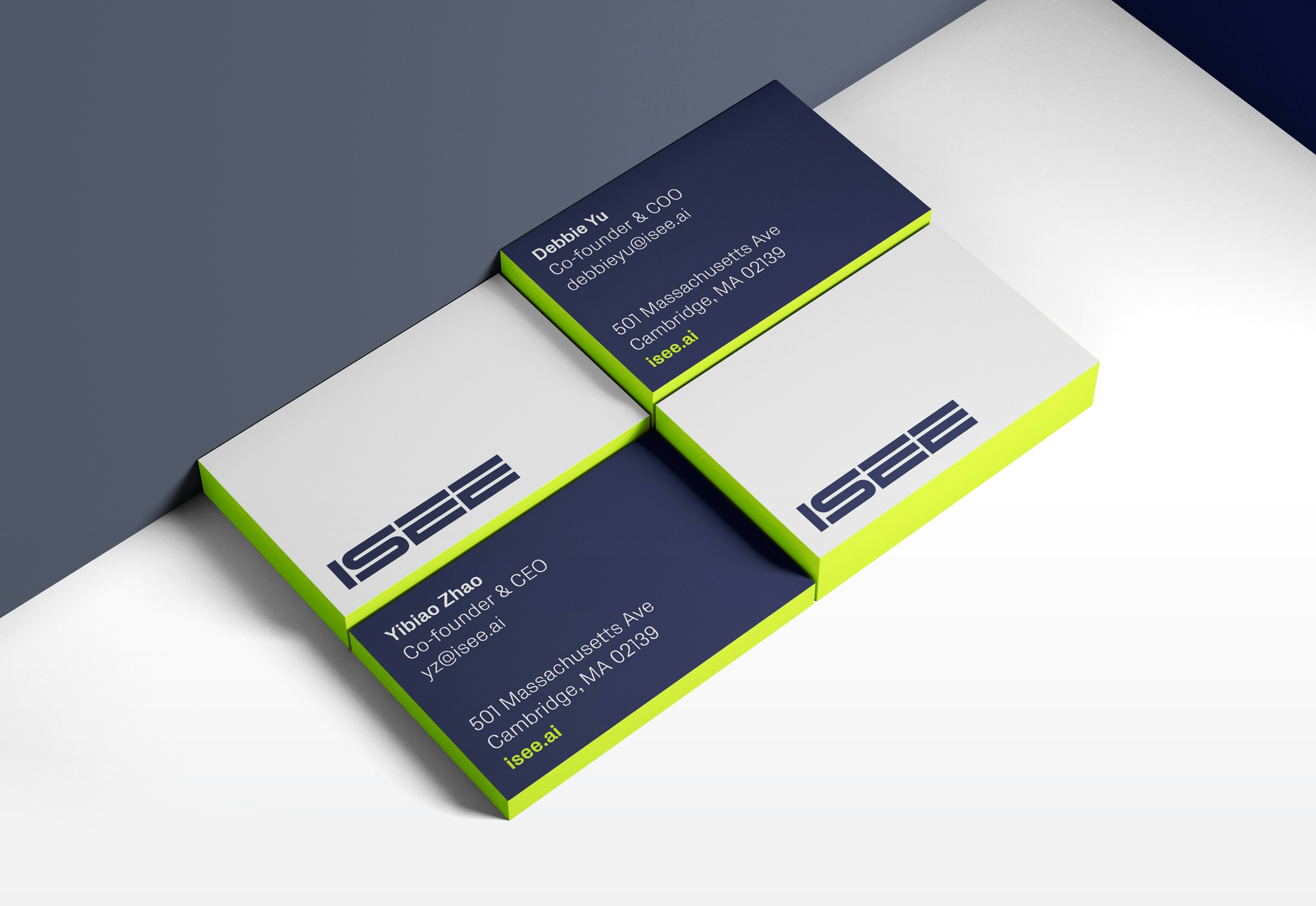 A stack of four ISEE business cards